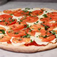 Caprese Pizza · Mozzarella, tomato and basil. 