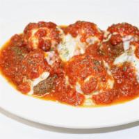 Meatball Parmigiana · Our homemade, broiled beef meatballs, baked with mozzarella cheese and tomato sauce. Served ...