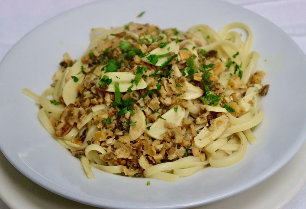 Linguine with White Clam Sauce · Linguini served in a sauce made with olive oil, garlic, parsley, white wine and clams. 