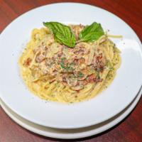 Spaghetti Carbonara · Spaghetti with a sauce made from eggs,cheese, cream, bacon and green peas. 