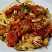 Cappellini Al Mare · Thin cappellini pasta in a homemade marinara sauce with shrimp, calamari, clams and mussels. 