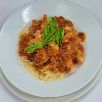 Cappellini with Shrimp Sauce · Thin cappellini pasta served with a sauce made of fresh shrimp, parsley, garlic, olive oil a...