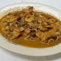 Veal Scaloppine Marsala · Tender veal cutlets, browned in a sauce of butter, Marsala wine and mushrooms. Served with c...