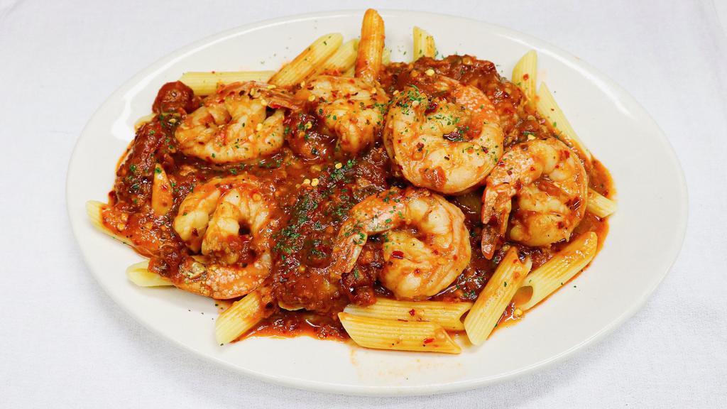 Shrimp Fra Diavolo · Sauteed jumbo shrimp served in a spicy fra diavolo sauce with choice of pasta or salad. 