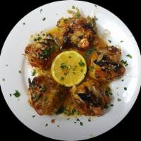 Stuffed Shrimp with Crabmeat · Jumbo shrimp stuffed with a mixture of crabmeat, chopped green pepper, seasonings and breadc...