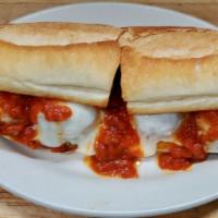 Meatball Parmigiana Hero · Homemade meatballs, served on a hot hero roll with melted mozzarella cheese and tomato sauce. 
