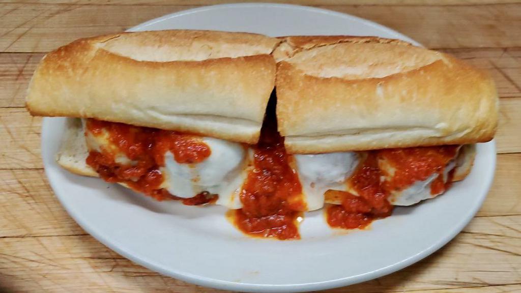 Meatball Parmigiana Hero · Homemade meatballs, served on a hot hero roll with melted mozzarella cheese and tomato sauce. 