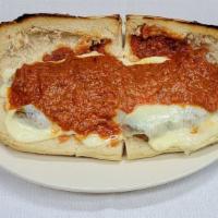 Sausage Parmigiana Hero · Broiled sausage links served on a hot hero roll with tomato sauce and melted mozzarella chee...