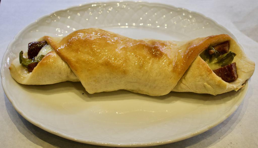 Sausage Roll · Pizza dough is wrapped around mozzarella and chopped sausage, then baked. The ends are left open. 