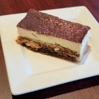 Tiramisu · A cake made of lady fingers soaked in coffee, layered with whipped cream and sweet mascarpon...