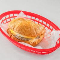Sausage Patty, Egg & Cheese Croissant · Finely minced meat formed into a patty and cooked. A flaky French pastry.