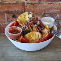 Viva Nachos · Corn tortilla, house beer cheese, tossed with pico de gallo, black beans, and jalapenos. Ser...