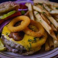 Bergen Burger · Angus beef burger served on brioche bread. Topped with bacon and onion ring. Served with fri...