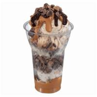 Reese's Peanut Butter Cup Layered Sundae · 3 scoops of Reese's peanut butter cup ice cream topped with layers of Reese's peanut butter ...