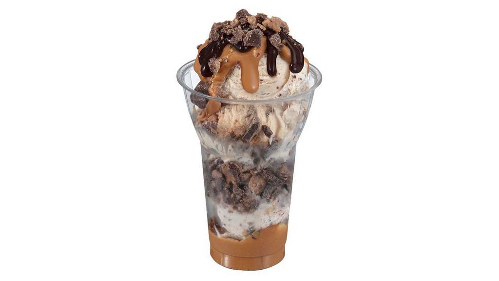 Reese's Peanut Butter Cup Layered Sundae · 3 scoops of Reese's peanut butter cup ice cream topped with layers of Reese's peanut butter sauce, chopped Reese's peanut butter cups, and hot fudge. Delivered products will not include whipped cream.