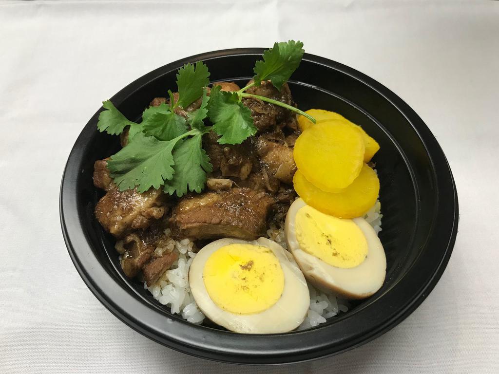 Braised Pork Rice Bowl · Pork belly braised in Chinese spices and soy sauce, with a soy sauce egg, veggies, and pickles.