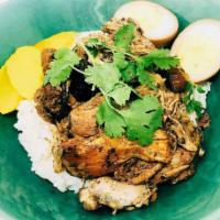 Braised Chicken Rice Bowl · Chicken thigh braised in Chinese spices and soy sauce, with a soy sauce egg, veggies, and pi...