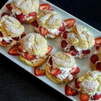 Strawberry Cream Puff · Pate a choux filled with vanilla pastry cream and fresh strawberries