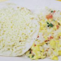 5. Huevos Pericos con Arroz y Arepa con Queso · Scrambled eggs with rice and corn cake with cheese.