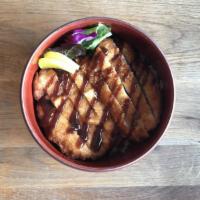 Tonkatsu Donburi · Panko breaded pork cutlets. Served in oversized rice bowls with miso soup.