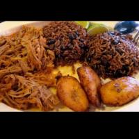 Ropa Vieja / Shredded Beef · Served with rice, beans and sweet plantains/ Servido con arroz. frijoles y maduros fritos