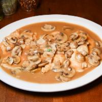Chicken Marsala Dinner · Boneless breast of chicken with imported Marsala wine and mushrooms sauce. Served with a cho...