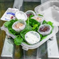 Personal Spinach Salad · Fresh spinach, feta cheese, sliced almonds and cranberries.