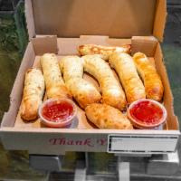 Beer Batter Bread Sticks · 8 pieces of golden brown beer batter dough covered in garlic butter. Served with a dipping s...