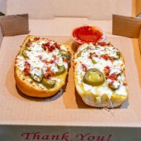 Bacon Jalapeno Bread · 2 slices of hot French bread covered with garlic butter, mozzarella cheese, bacon and jalape...