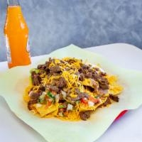 Super Nachos · Your choice of protein, with tortilla chips, guacamole, sour cream, beans, cheese, and Mexic...