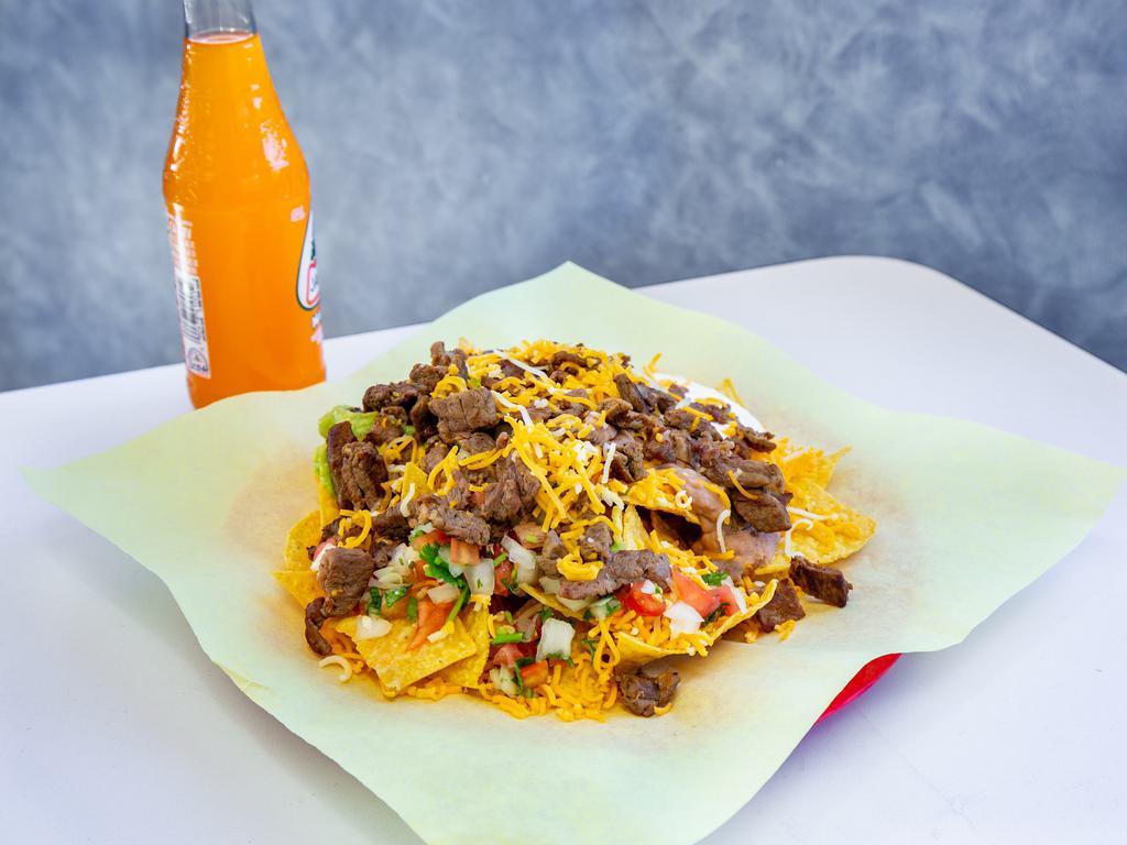 Super Nachos · Your choice of protein, with tortilla chips, guacamole, sour cream, beans, cheese, and Mexican salsa.