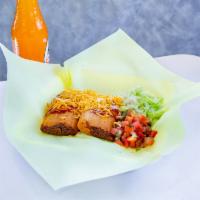 Tamales · Your choice of chicken, beef or pork. Comes with enchilada sauce and cheese on top, sour cre...