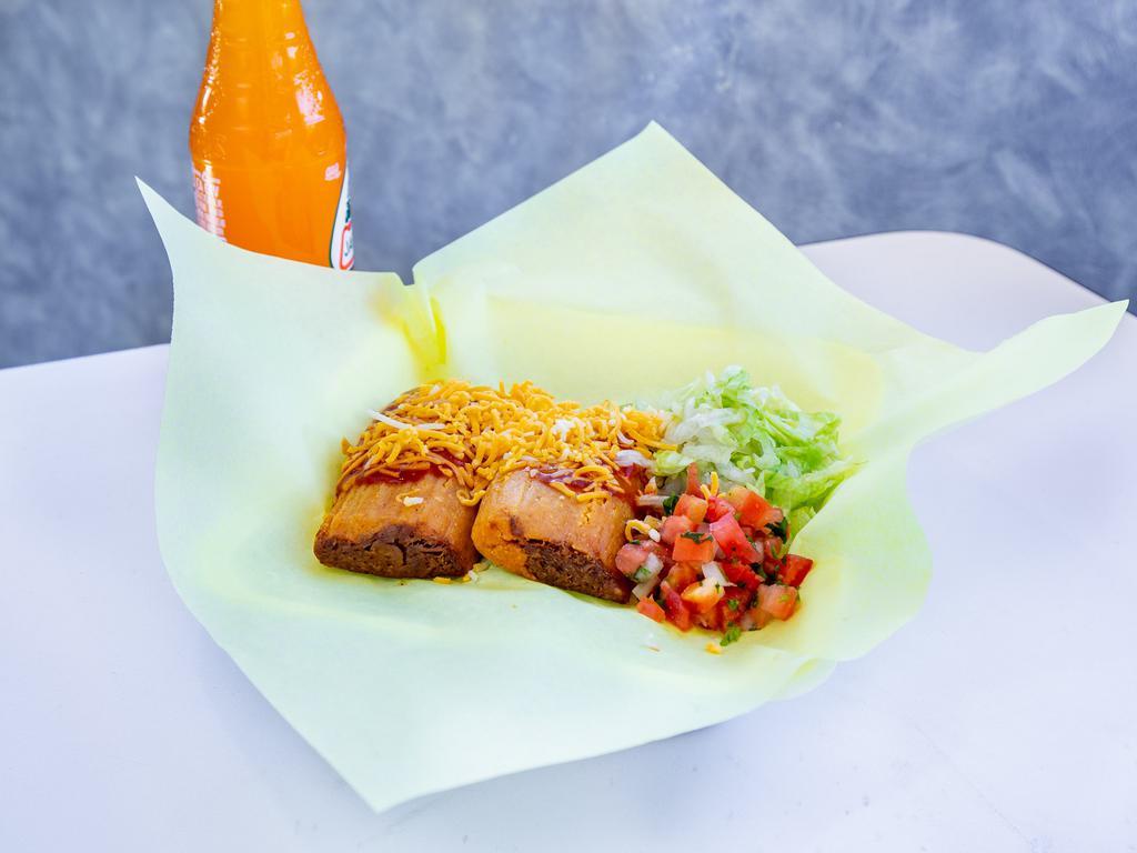 Tamales · Your choice of chicken, beef or pork. Comes with enchilada sauce and cheese on top, sour cream and lettuce on the side.