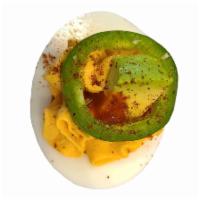 South of the Border · Mexican hot sauce, cheddar cheese, & latin spices. topped with jalapeño & fresh avocado.