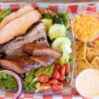 Taste of the Farm Salad · Fresh green salad topped with brisket, sausage and chicken, served with salad dressing. Fres...