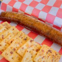 Smoked Boudin · With spicy crackers.