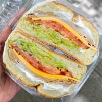 Deli Slice Sandwich (VEGAN) · Tofurky Deli Slices, Lettuce, Tomato & Follow Your Heart Cheese
