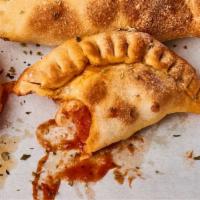 Cheese Calzone · perfectly simple, tomato sauce & cheesy goodness folded, crimped and baked