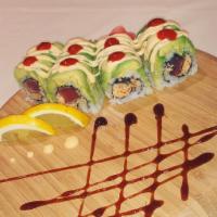 Volcano Roll · Spicy kani, pepper tuna, topped with avocado, spicy mayo and Sriracha sauce.