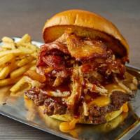 JFK Burger · Apple wood bacon, sharp cheddar, honey BBQ sauce, homemade pickles and crispy onions. Secret...