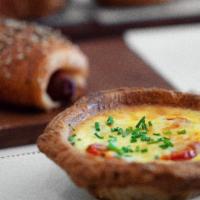 Veggie Quiche · Our croissant crust filled with out creamy mixture of eggs and assorted veggies.