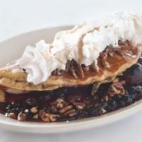 Bahama Pancakes · A big pancake stuffed with blueberries, strawberries and bananas, topped with whipped cream ...