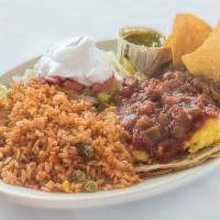 Huevos Rancheros · 2 fried eggs simmered in hot sauce, served on warm corn or flour tortillas with rice and bea...