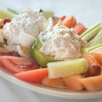 Stuffed Avocado Salad · Fresh-made tuna salad, lettuce, cottage cheese, hard-boiled egg and seasonal fresh fruit sli...