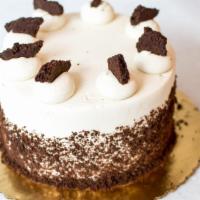 Cookies and Cream Ice Cream Cake · Two layers of Cookies & Cream ice cream, chocolate cookie crumble and vanilla buttercream