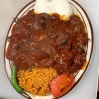 Iskender · Thin layers of lamb gyro over crispy bread, covered with yogurt and a special tomato sauce, ...