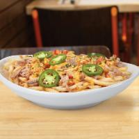 Green Chile Pork Fries · Shoestring fries, BBQ shredded pork, green chile queso and jalapeno slices.