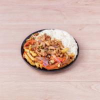 Saltado de Pollo · Chicken sauteed in soy sauce, onion, tomato served with french fries and rice.