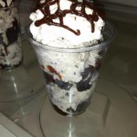 Oreo Sundae · Cookies and cream ice cream topped with chopped Oreos, hot fudge, whipped cream.
