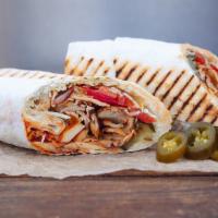 Chicken Shwarma · Sauced chicken stacked in a wrap, and roasted on a slowly turning vertical rotisserie.